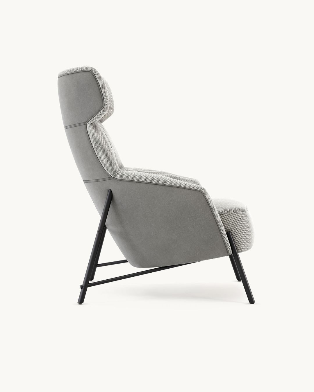 Modernus fotelis aukštu atlošu ir pilkos spalvos audiniu